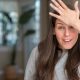 Girl stressed out with hand on head