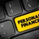 personal finance words on a keyboard